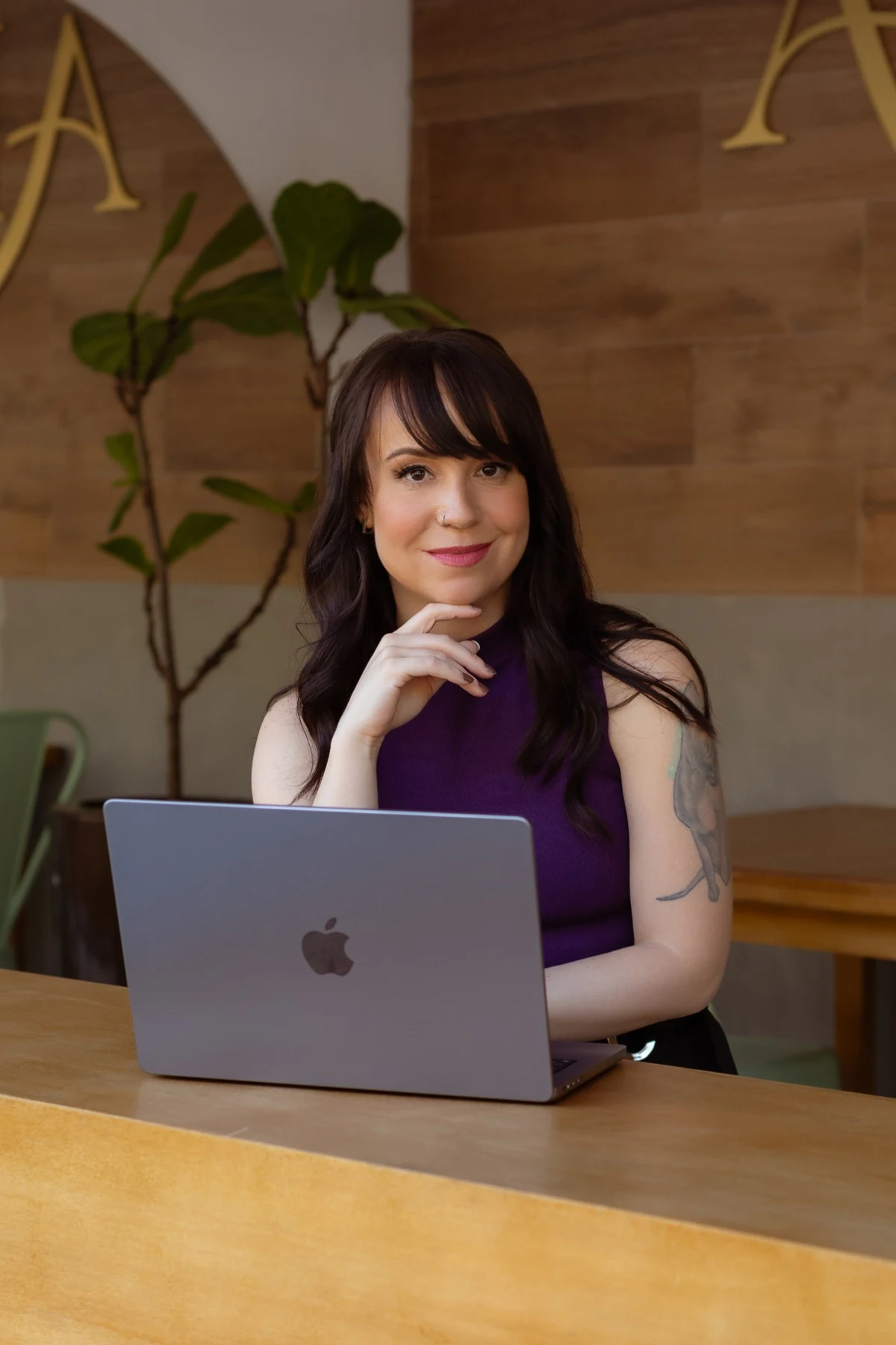 Fer Brunello at her laptop, ready to teach